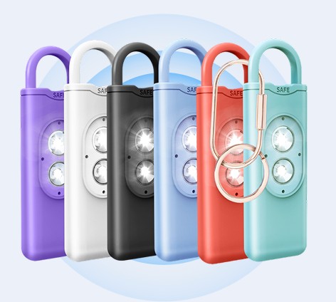 Official HerAlarm image showing the alarm in six colors with a key ring